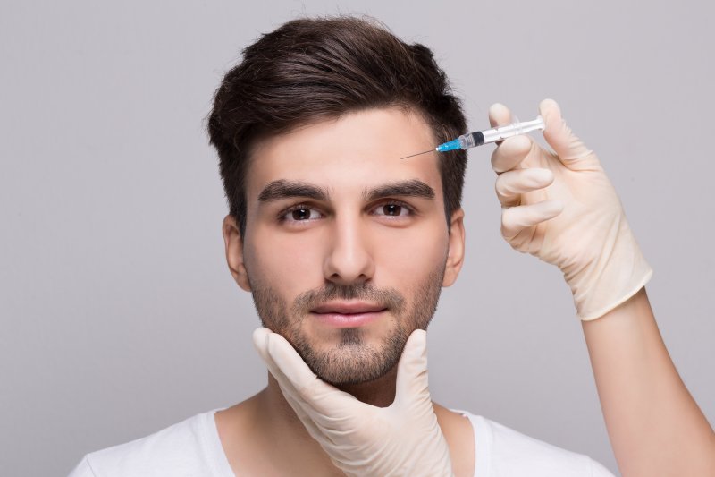 A young man receiving dermal fillers